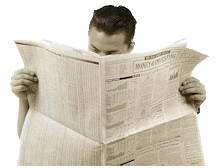 Picture of person reading newspaper.