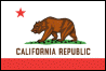 Image of the California State flag.  The current California State Flag, adopted by the state legislature in 1911, is based on the original Bear Flag raised by pioneering Americans over Sonoma in 1846. Most of the flag's field is white, with a small band of red running horizontally along the bottom.  The upper, white portion features a single red star, which may have come from the 'Lone Star' on the flag of the Republic of Texas. There is also a Grizzly Bear, representative of the numerous Grizzly Bears in the state and symbolizing courage. The words 'California Republic', placed beneath the bear and star in black letters, testify to the fiesty American pioneers who settled in the territory.