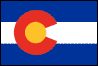 Image of the Colorado State flag.  The flag consists of three alternate stripes of equal width and at right angles to the staff. The two outer stripes are blue of the same color as in the blue field of the national flag and the middle stripe is white. At a distance from the staff end of the flag of one fifth of the total length of the flag there is a circular red C, of the same color as the red in the national flag of the United States. The diameter of the letter is two-thirds of the width of the flag. The inner line of the opening of the letter C is three-fourths of the width of its body or bar, and the outer line of the opening is double the length of the inner line thereof. Completely filling the open space inside the letter C is a golden disk. The red 'C' stands for Colorado, the Spanish word for colorful. The colors used in the Colorado State Flag represent environmental features of the state. The gold represents the abundant sunshine enjoyed by the state. The blue sybolizes the clear blue skies of Colorado. White represents the snow capped mountains of the state and red represents the color of much of the state's soil. The flag design was adopted in 1911, and amended in 1924 and 1964.