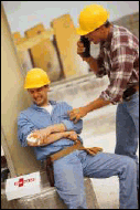 Picture of injured worker receiving first aid from coworker