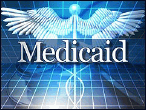 Graphic for Medicaid program, with text 'Medicaid' in white letters superimposed over a symbol of a short rod entwined by two snakes and topped by a pair of wings, which is actually the caduceus or magic wand of the Greek god Hermes (Roman Mercury), messenger of the gods, inventor of (magical) incantations, conductor of the dead and protector of merchants and thieves, all on blue background.