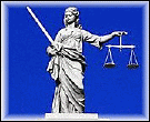 Image of Justitia holding the scales of justice in one hand and a sword in the other on blue background.