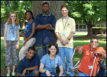 Picture of group of secondary-aged students with disabilities posing under a tree.