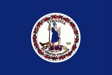 Image of the Virginia State Flag.  The flag has a deep blue field with a circular white center that contains the obverse side of the Great Seal of Virginia, with 'Virginia' at the top of the seal and the Latin motto 'Sic Semper Tyrannis' - 'Thus Always to Tyrants' at the bottom. Adopted in 1776, when Virginia and the other colonies were fighting for independence from England, it shows two figures acting out the meaning of the motto. Both are dressed as warriors. It depicts the Roman goddess Virtus representing the spirit of the Commonwealth. She is dressed as an Amazon, a sheathed sword in one hand, and a spear in the other, and one foot on the form of Tyranny, who is pictured with a broken chain in his left hand, a scourge in his right, and his fallen crown nearby, implying struggle that has ended in complete victory. A border of Virginia creeper, in red and green colors, encircles the design of the seal, and a white silk fringe adorns the edge of the flag farthest from the flag staff. The flag was adopted in 1861.